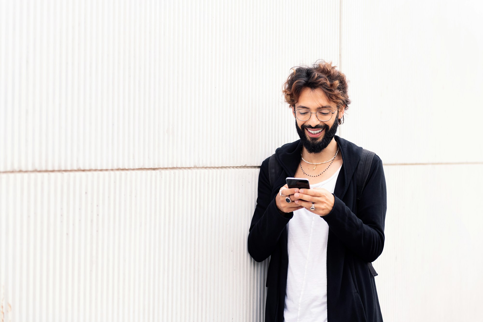 smiling young man talking on mobile phone